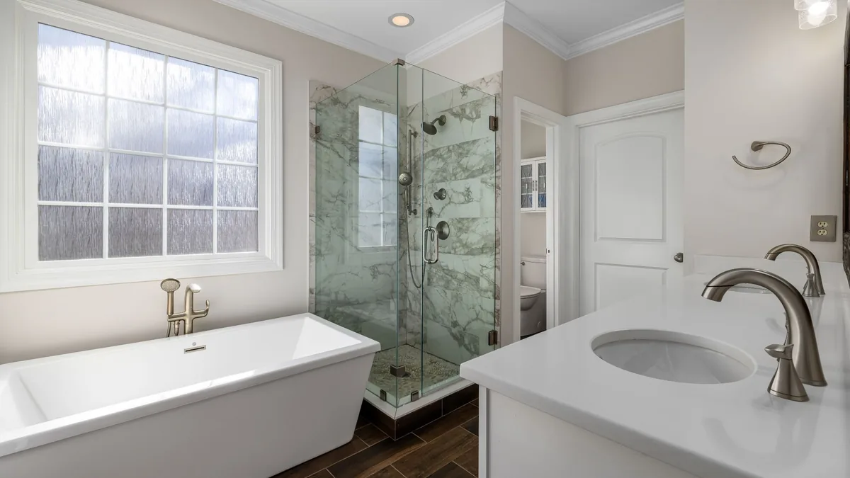 Fully remodeled bathroom with tile and vanity in Des Moines, IA