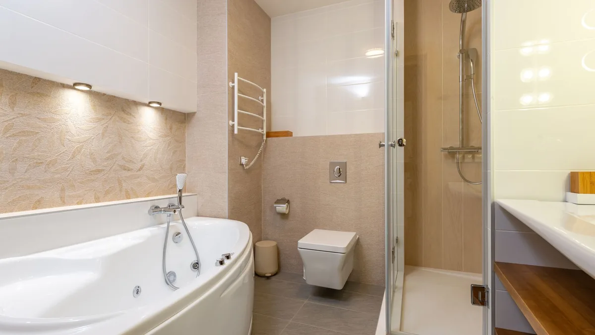 Newly installed bathtub with tile surround in Des Moines, IA