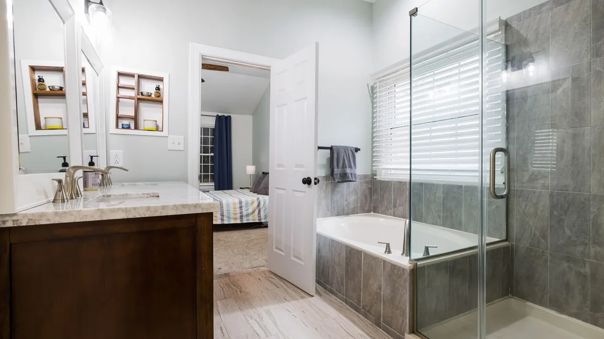 Tiled shower built in a former tub alcove in Des Moines, IA